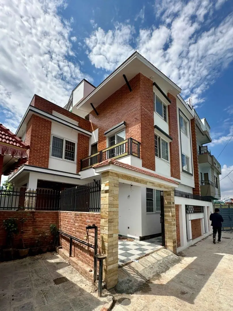 Brick Residence with Timber Interiors: Brick-clad residence with timber stair and interiors, built by HNG, image 1 of 4